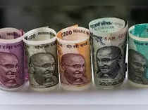 Rupee edges down as Fed commentary boosts dollar broadly