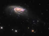 700 million light-years away! Jellyfish galaxy JO 206 swims across Hubble Telescope's lens