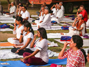 Noida: People do yoga at Triphala Park, in Noida. International Day of Yoga will...