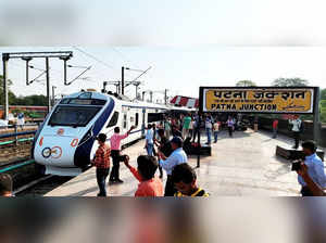 Patna: People take pictures of the semi-high speed Vande Bharat Express that wil...