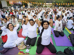 Mumbai: Students perform yoga during a session organised by the Patanjali Yoga S...