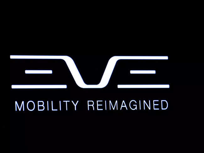 FILE PHOTO: The logo for Eve Air Mobility is displayed on a screen during the company’s debut on the floor of the NYSE in New York