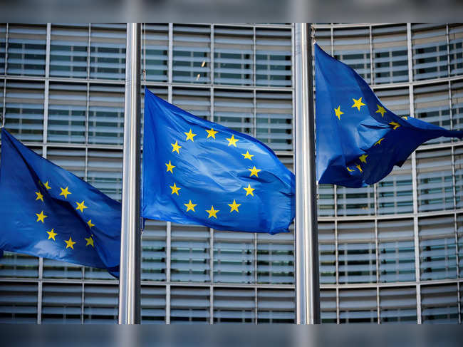 FILE PHOTO: European Union flags fly outside the European Commission headquarters in Brussels