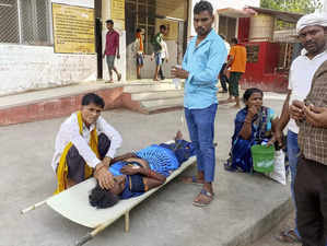 Ballia: Family members with their patient at a hospital during heatwave conditio...