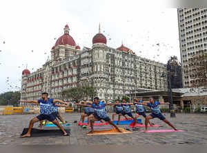 **EDS: IMAGE VIA INDIAN NAVY** Mumbai: Navy personnel perform yoga at the Gatewa...