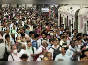 Mumbai: People board a train during peak hours at CSMT in Mumbai. India has surp...