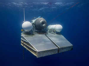 This undated image courtesy of OceanGate Expeditions, shows their Titan submersible on a platform awaiting signal to dive. Rescue teams expanded their search underwater on June 20, 2023, as they raced against time to find a Titan deep-diving tourist submersible that went missing near the wreck of the Titanic with five people on board and limited oxygen. All communication was lost with the 21-foot (6.5-meter) Titan craft during a descent June 18 to the Titanic, which sits at a depth of crushing pressure more than two miles (nearly four kilometers) below the surface of the North Atlantic. - RESTRICTED TO