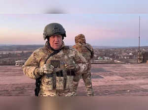 (FILES) This video grab taken from a video posted on Telegram channel @concordgroup_official on March 3, 2023, shows Yevgeny Prigozhin, the chief of the Russian paramilitary group Wagner speaking to the camera from a rooftop at an undisclosed location. Prigozhin declared his fighters have "practically encircled" Bakhmut. Yevgeny Prigozhin, the head of the Wagner mercenary group, vowed on June 24, 2023 to "go to the end" to topple the Russian military leadership, whom he accused of launching strikes on his men, while the country's prosecutor general said he was under investigation for "armed rebellion". - RESTRICTED TO EDITORIAL USE -