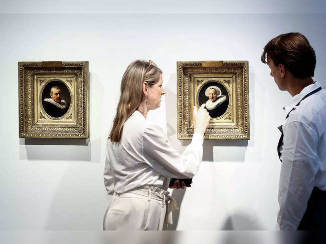 Manja Rottink, Senior international specialist of old master paintings at Christie’s presents  two paintings attributed to Dutch artist Rembrandt at Christies auction house in Amsterdam on June 21, 2023.  The two portraits will go under the hammer next July 6, 2023, in London. (Photo by Kenzo TRIBOUILLARD / AFP)