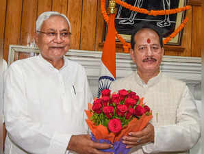 Patna: Bihar Chief Minister Nitish Kumar greets Speaker Vijay Kumar Sinha on the...