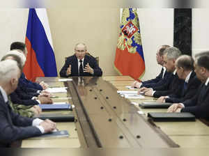 Russian President Vladimir Putin chairs a meeting with the heads of Russian law ...