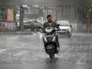 New Delhi:  Vehicles ply on road as heavy rainfall lashes in New Delhi, on Friday, June 16, 2023.  (Photo:IANS/Anupam Gautam)