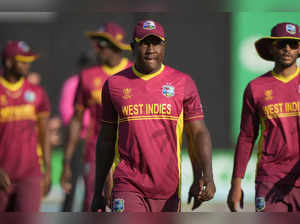 West Indies player Rovman Powell walks off the pitch after losing to Scotland in...