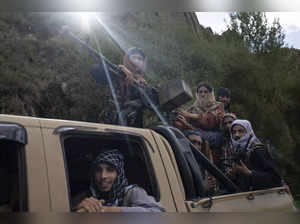 Wardak: A unit of Taliban fighters ride in a pickup truck on a road in Wardak pr...