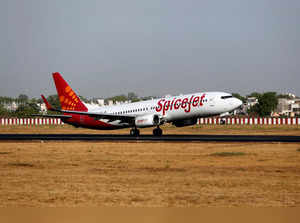 FILE PHOTO: A SpiceJet Boeing 737 passenger aircraft takes off from Sardar Vallabhbhai Patel international airport in Ahmedabad