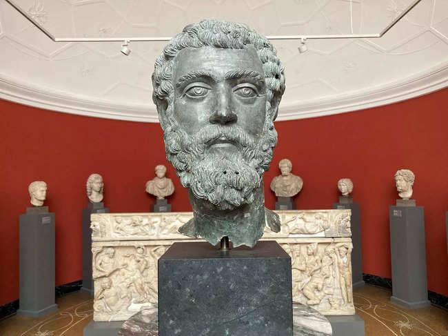 This photo taken on June 29, 2023 shows a bronze head of Roman Emperor Septimius Severus (145 AD-211 AD), Asia Minor, ca 195-211, displayed at the Ny Carlsberg Glyptotek museum in Copenhagen.  Does the bronze head of Emperor Septimius Severus, on display at a Copenhagen museum, belong to a statue that has been returned to Turkey? Danes certainly have their doubts. After decades in the United States, as part of a private collection that loaned it to New York's Metropolitan Museum, the statue of the Roman emperor, who lived from AD 145 to 211, was recently sent back to