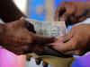 Indian rupee range bound in near term, to rise a bit in a year