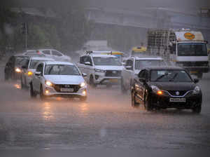 Gurugram, July 04 (ANI): Vehicles wade through amid heavy rain, in Gurugram on T...