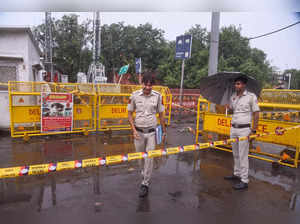 New Delhi: Police personnel inspect the incident site where a woman died of elec...