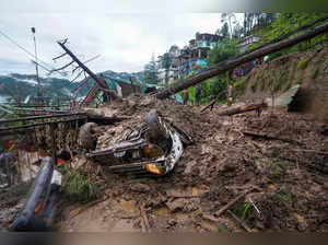 Shimla: Vehicles buried after a landslide following heavy rainfall, in Shimla. (...