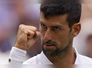 Serbia's Novak Djokovic reacts after beating Poland's Hubert Hurkacz in a men's ...