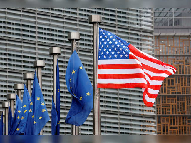 FILE PHOTO: U.S. and EU flags are pictured during the visit of Vice President Pence to the European Commission headquarters in Brussels