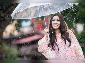 beautiful-girl-in-the-rain-with-transparent-umbrella-photo