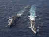 China sends large group of warplanes, navy ships towards Taiwan in forceful display