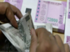 Rupee gains on dollar's dip, but nears resistance zone