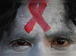(FILES) A social activist with his face painted takes part in an awareness campaign organised to observe ‘World AIDS Day’ in Kolkata on December 1, 2022. "AIDS can be ended by 2030," the UNAIDS agency said on July 13, 2023, as it outlined a roadmap of investment, evidence-based prevention and treatment, as well as tackling the inequalities currently holding back progress. (Photo by DIBYANGSHU SARKAR / AFP)