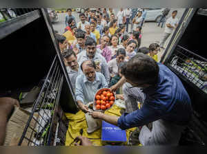 New Delhi: People buy tomatoes at a discounted rate of Rs 90/kg outside Krishi B...