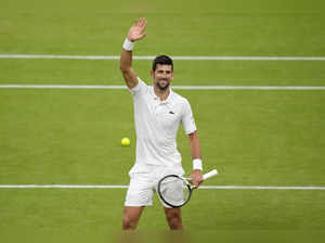 Serbia's Novak Djokovic reacts after beating Italy's Jannik Sinner to win their ...
