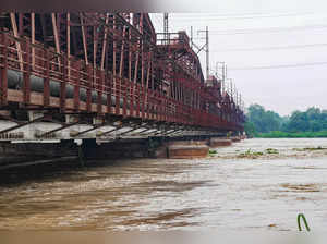 New Delhi: The swollen Yamuna river flows under Old Yamuna Bridge (Loha Pul), in...