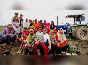 Sonipat: Congress leader Rahul Gandhi with women farmers at a farm in Sonipat di...