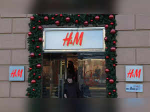 A woman walks out of an H&M store in Moscow