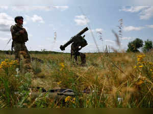 Ukrainian servicemen of an air defence unit operate a Swedish RBS 70 portable air-defence system during their combat shift in Kyiv region