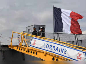 Sailors of the French navy destroyer Lorraine stand guard while the ship is docked at the port in Manila on June 28, 2023. Lorraine is here for a port call.  (Photo by Ted ALJIBE / AFP)