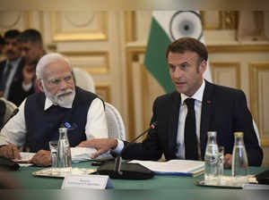 French President Emmanuel Macron and India's Prime Minister Narendra Modi attend...