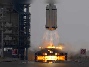 A Long March rocket carrying a crew of Chinese astronauts in a Shenzhou-16 space...