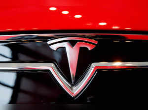 FILE PHOTO: A Tesla logo on a Model S is photographed inside of a Tesla dealership in New York