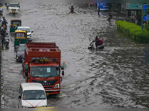 New Delhi: Vehicles move through the waterlogged Vikas Marg following monsoon ra...