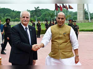 Argentine Defence Minister Jorge Taiana (L) shakes hands with his Indian counterpart Rajnath Singh (R) before inspecting a guard of honour at the Manekshaw Centre in New Delhi on July 18, 2023. (Photo by Sajjad HUSSAIN / AFP)