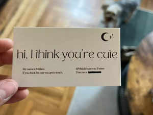 Woman takes a traditional approach to dating, creates a business card for flirting