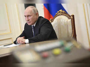 Russian President Vladimir Putin attends a meeting on the situation in the area ...