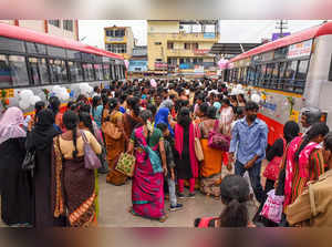 Chikmagalur: Women wait to board buses after the launch of Shakti Scheme, in Chi...