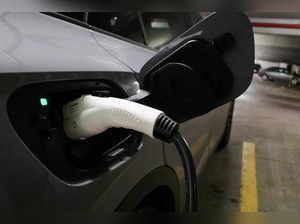 FILE PHOTO: A charging handle recharges a Volkswagen ID.4 electric vehicle parked at an EV charging station in Baltimore
