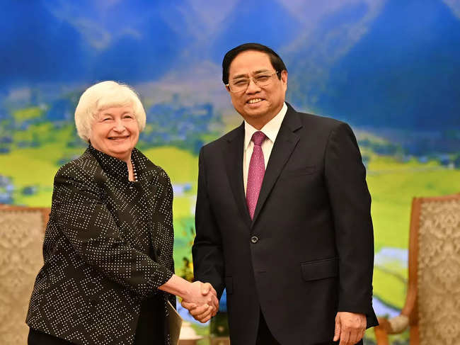 Yellen shakes hands with Vietnam's Prime Minister Pham Minh Chinh, in Hanoi.