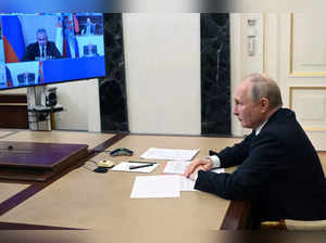 Russian President Vladimir Putin chairs a Security Council meeting via videoconf...