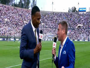 ESPN soccer expert Shaka Hislop collapses during Real Madrid vs AC Milan match. Watch video