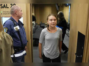 Climate activist Greta Thunberg of Sweden leaves a court room after a hearing in...